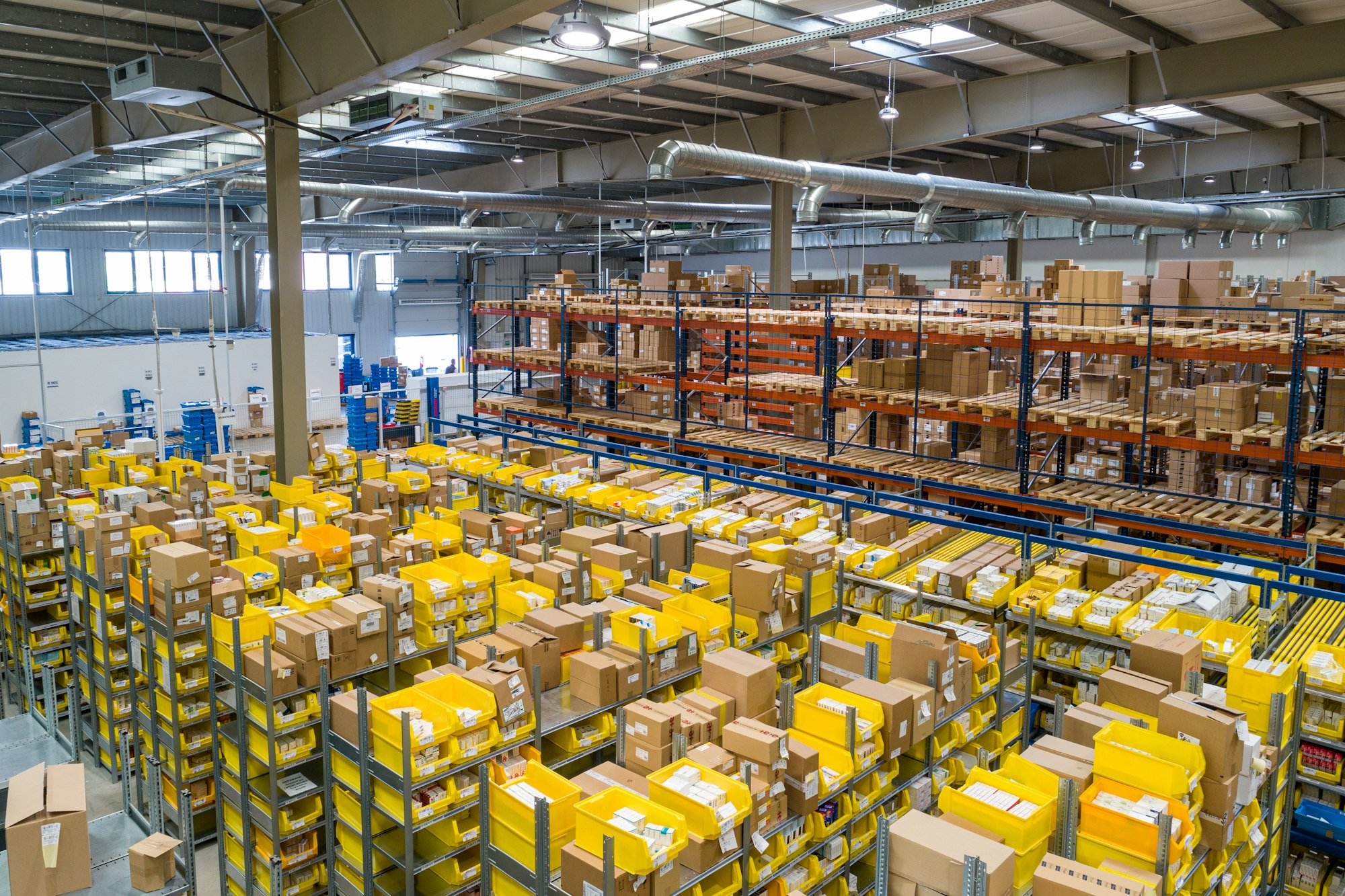 Warehouse floor with racking, pallets and packed stock